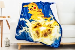 Lifestyle image of Pokemon Throw Blanket over couch (Walmart.com)