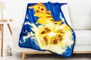Lifestyle image of Pokemon Throw Blanket over couch (Walmart.com)