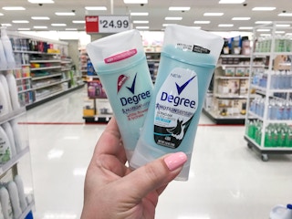 hand holding 2 degree deodorant in a target aisle