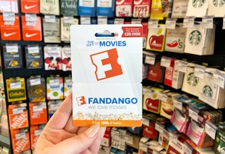 a hand holding a gift card in a store