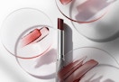 clinique black honey lipstick with swatches on round glass