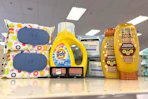 garnier whole blends shampoo, neutrogena wipes, maybelline eyeshadow, tide simply, and honest wipes on a shelf