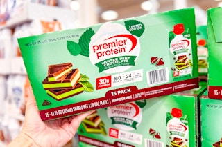 hand holding a box of premier protein winter mint chocolate shakes