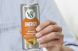 Person Holding V8 Energy Drinks 12-Pack