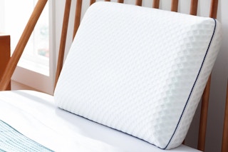 Lifestyle image of the Linenspa Gel Memory Foam Bed Pillow in bedroom setting (close up shot)
