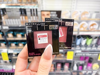 hand holding two Maybelline Fit Me blushes