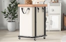 a laundry basket on wheels in a room