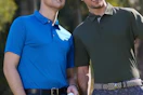 men at golf course wearing polos