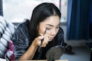 Woman applying Eyeliner