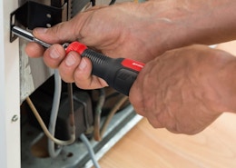 a person using a screwdriver