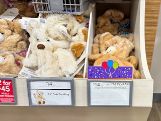 A shelf of Build-A-Bear's Birthday Bears with the price of $14 or Pay Your Age