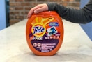 Tide pods with arm resting on top