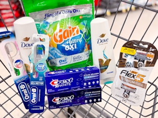 a shopping cart full of personal care products and laundry detergent