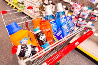 gillette shave cream, arm & hammer detergent, loreal elvive shampoo, crest mouthwash, and oral b toothbrushes in a cart