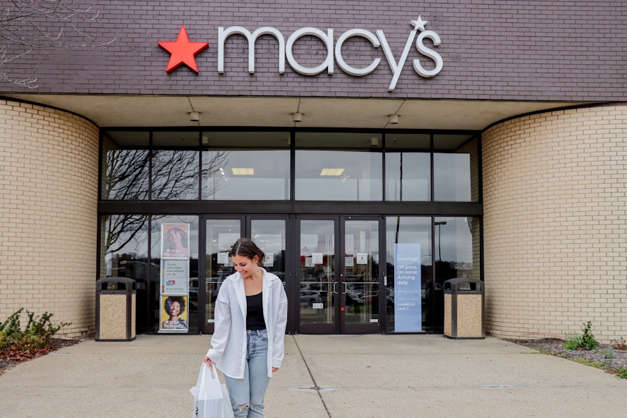 a woman walking out of macy