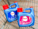 2 persil laundry detergent bottles sitting in a walmart cart