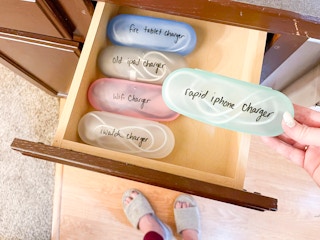 someone putting cords in glasses cases