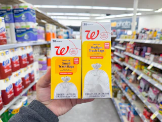 hand holding walgreens trash bags