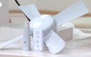 a socket fan in a room over flowers