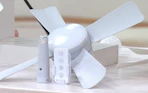 a socket fan in a room over flowers