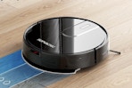 ROPVACNIC Robot Vacuum Cleaner cleaning hardwood floors.