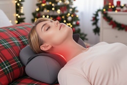 a woman laying on a cervical neck pillow