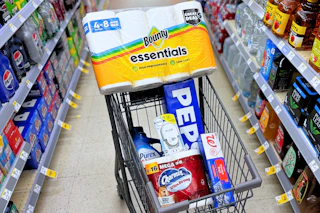 shopping cart with bounty, pepsi, charmin, purex, and walgreens brand items
