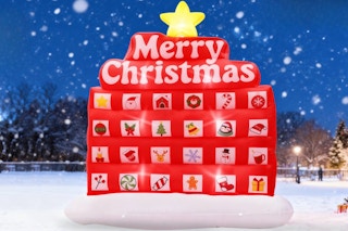PETUOL Christmas Advent Calendar Inflatable outside in the snow at night.