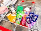 air wick warmer, bandages, gillette razor, irish spring and softsoap body washes, and crest toothpaste in a cart