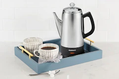 a cuisinart percolator near coffee