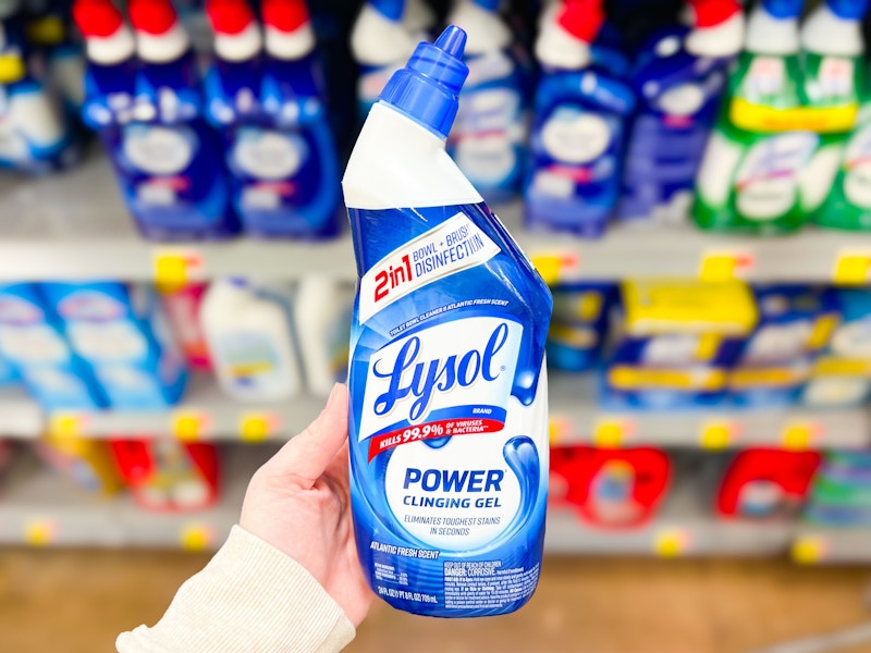 person holding lysol toilet bowl cleaner