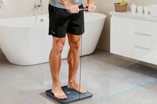 man standing on smart scale