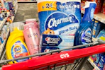 tide simply, loreal elvive shampoo, crest toothpaste, charmin toilet paper, and dawn powerwash in a cart