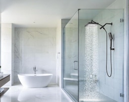 a shower with a rainfall shower head in a bathroom 