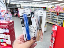 hand holding covergirl makeup in walgreens