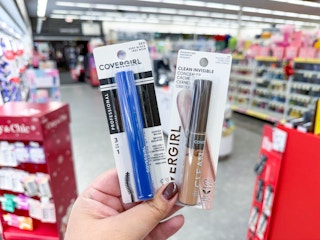 hand holding covergirl makeup in walgreens