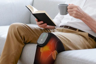 a man using a knee massager