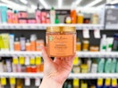 person holding sheamoisture styling gel