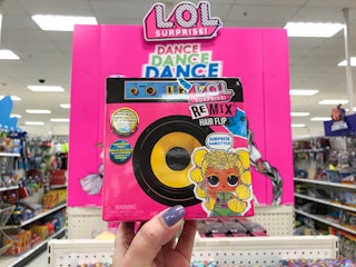 hand holding a lol surprise remix hair flip doll at target
