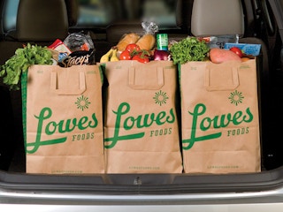 Bags of groceries from Lowe's Foods in a vehicle trunk