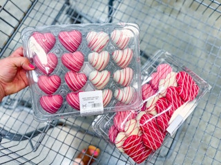 members mark heart shaped cookies and cake bites in shopping cart