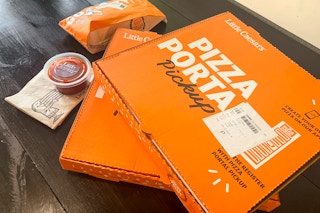 little caesar pizzas on a table