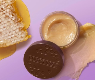 two purple and orange pack of lip treatment and scrub