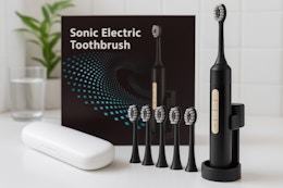 This Electric Toothbrush Comes With 10 Brush Heads —  Just $9.59 on Amazon card image