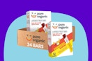 Pure Organic Layered Fruit Bars on a blue background.