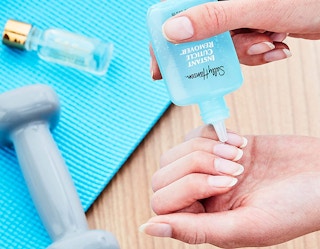 cuticle remover being applied on fingernails