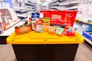 a storage tub with an office depot basket and other products on top