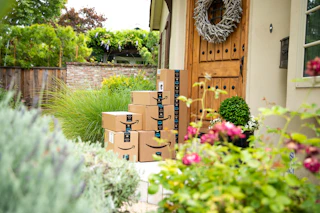 amazon boxes sitting on a front porch