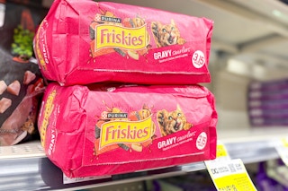 friskies dry cat food stacked on store shelf
