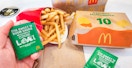 a person holding up the new loki sauce from mcdonalds